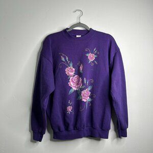 Purple crewneck sweatshirt with embroidered floral design
